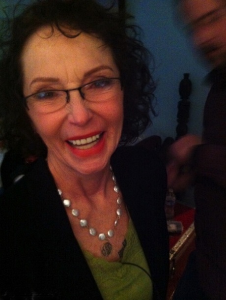 Curly haired mature woman likes sending her younger partner provocative photos