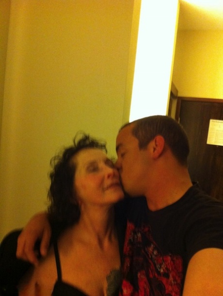 Curly haired mature woman likes sending her younger partner provocative photos