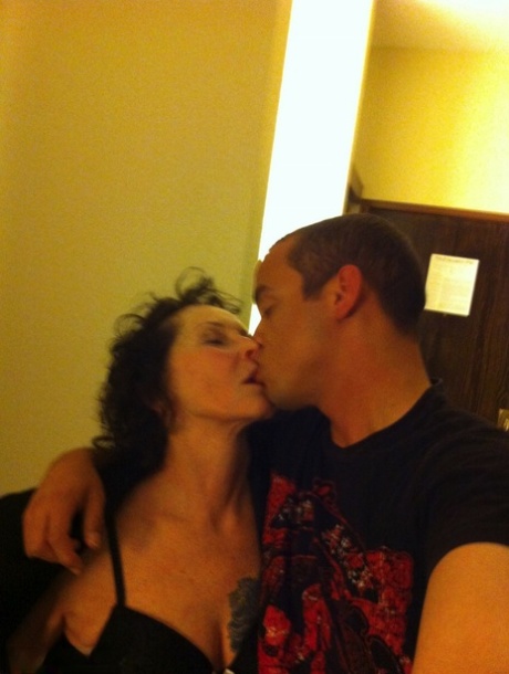 Curly haired mature woman likes sending her younger partner provocative photos