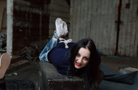 Two white girls are hogtied and ball gagged in sweaters and jeans