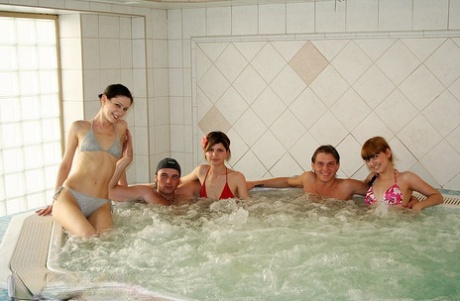 Barely legal coeds experiment with hardcore group sex in and out of a hot tub