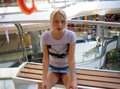 Blonde amateur Adele exposes her bare ass in lingerie before flashing upskirts