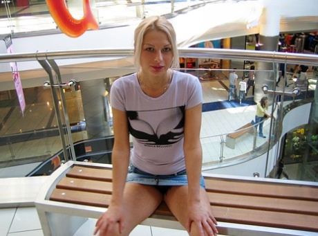 Blonde amateur Adele exposes her bare ass in lingerie before flashing upskirts