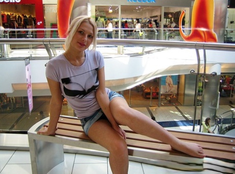 Blonde amateur Adele exposes her bare ass in lingerie before flashing upskirts