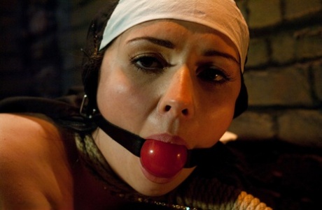 Horny nun masturbates with a cross before bondage sex takes place
