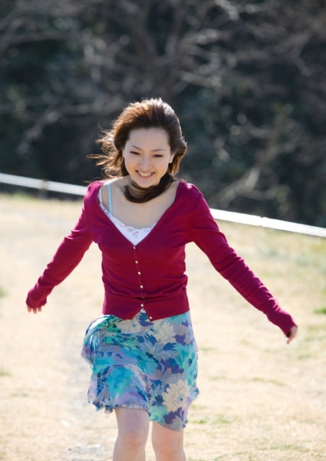 Beautiful Japanese girl Maiko Kazano uncovers her great tits as she gets naked
