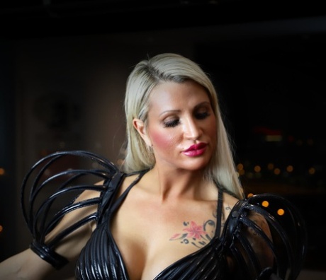 Seductive blonde temptress with big tits strikes hot solo poses