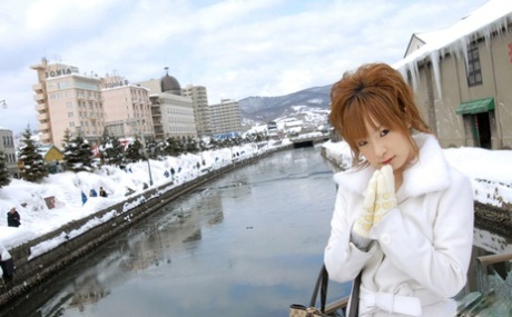 Cute redheaded Japanese teen Rinko gets naked to bathe on a winter's day