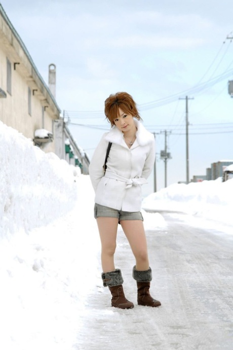 Cute redheaded Japanese teen Rinko gets naked to bathe on a winter's day