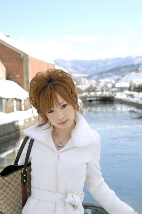 Cute redheaded Japanese teen Rinko gets naked to bathe on a winter's day