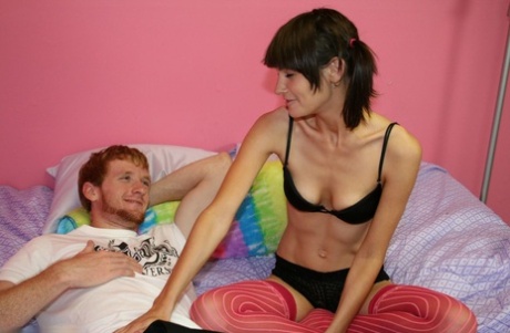 Slim teen gets jizz in her black hair after jerking her guy's large dick