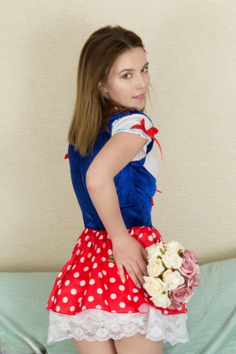 Nice teen Stella puts down a bouquet of flowers before getting naked