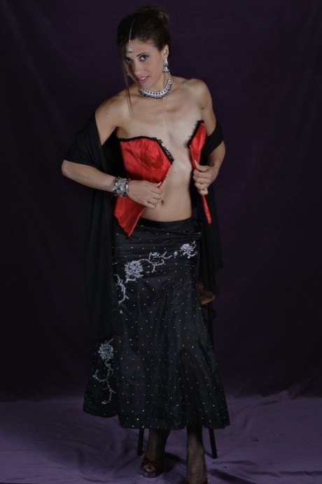 Skinny Indian female uncovers her tiny breasts during a solo shoot