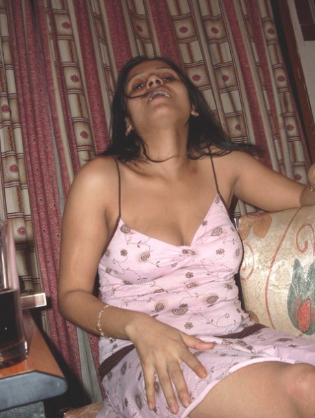 Indian female bares big naturals and butt while smoking a cigarette