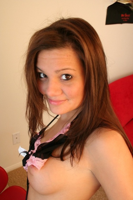 College girl Nadia takes off her bikini on red chair during solo action