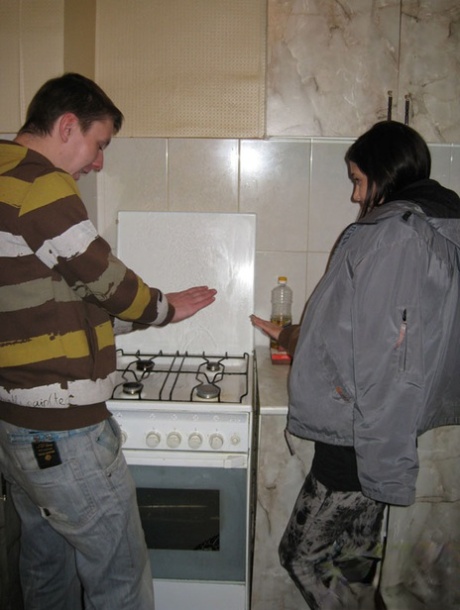 Teen lovers engage in a hard couples fuck in the kitchen