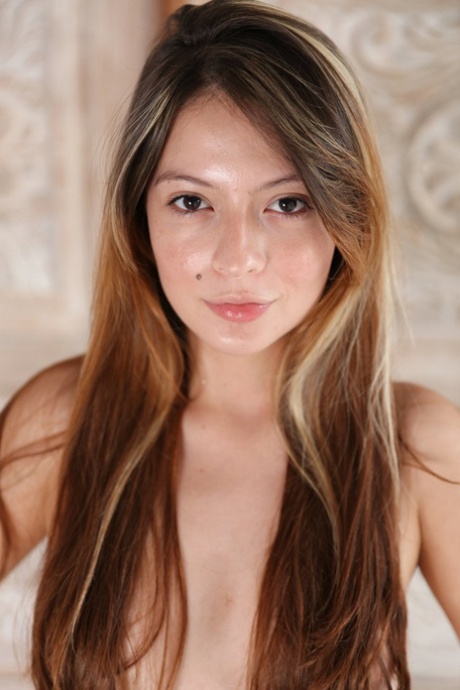 Topless teen Abella Jade releases her shaved vagina from fishnet pantyhose