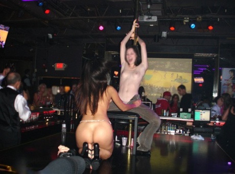 Asian stripper Katsuni is captured in candid action at an adult club