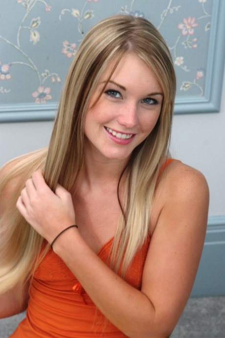 Sweet blonde Jewel slips off her pyjama bottoms to get completely naked