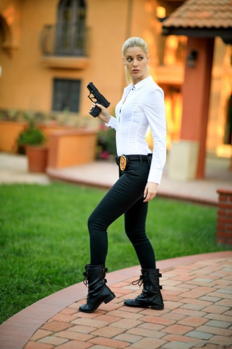 Blonde female cop strips to her black boots out on the condo walkway
