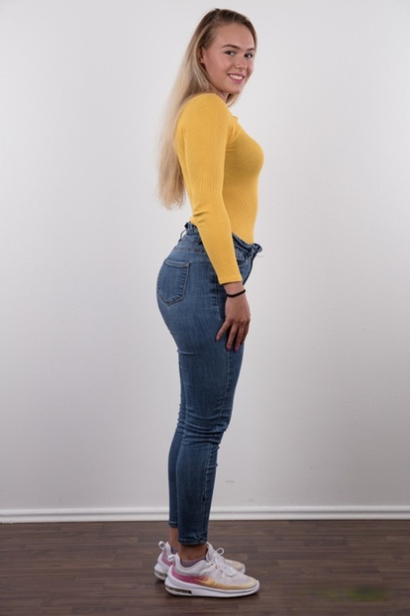 Fully clothed 18 year old Silvie stands butt naked after removing her clothes