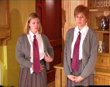 Misbehaving female students receive a brutal paddling from a female teacher