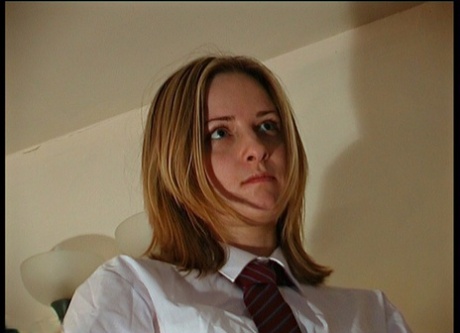 Misbehaving student gets bent over a man's knee for a hard spanking