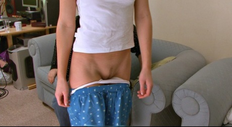 Misbehaving girl receives a paddling across her bare ass from her stepdad