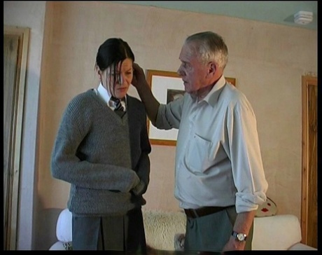Dark haired schoolgirl has her bare ass paddled and caned by her old stepdad