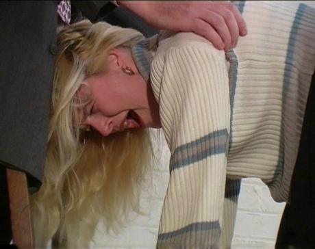 Blonde teen has her bare ass turned red during a caning session