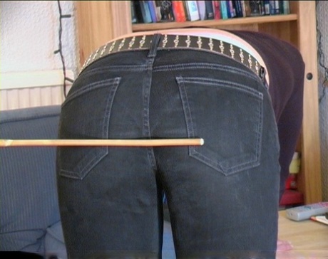 Caucasian woman has her bare ass turned bright red during a discipline session
