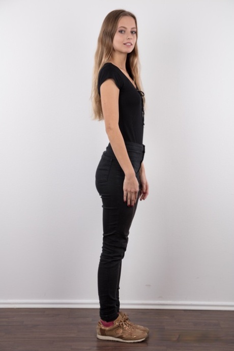 Tall teen Eliska stands totally naked while making her nude modeling debut
