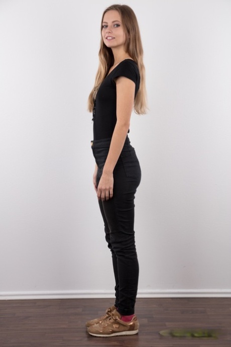 Tall teen Eliska stands totally naked while making her nude modeling debut