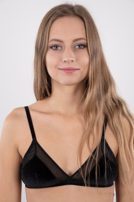 Tall teen Eliska stands totally naked while making her nude modeling debut