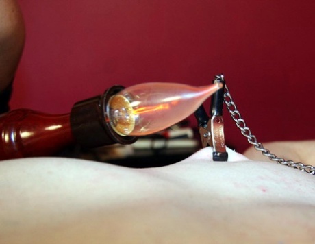 Dominant woman gives a restrained male sub the CBT treatment