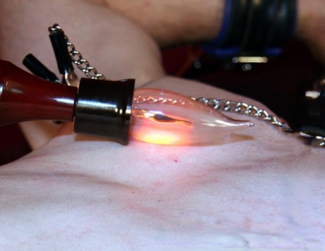 Dominant woman gives a restrained male sub the CBT treatment