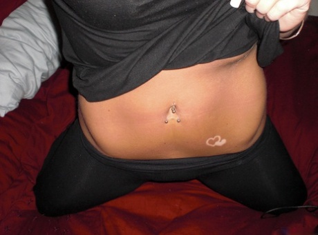 Amateur chick takes self shots while getting totally naked on her bed