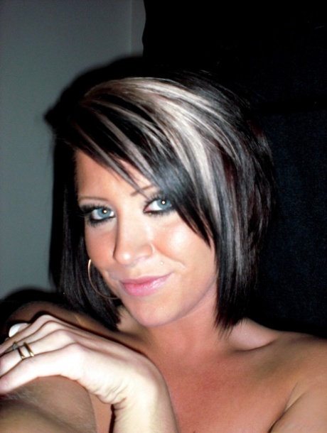 Amateur chick takes self shots while getting totally naked on her bed