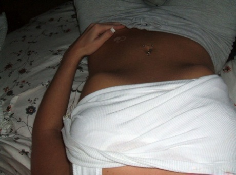 Blonde amateur removes her pants while taking self shots