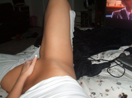 Blonde amateur removes her pants while taking self shots