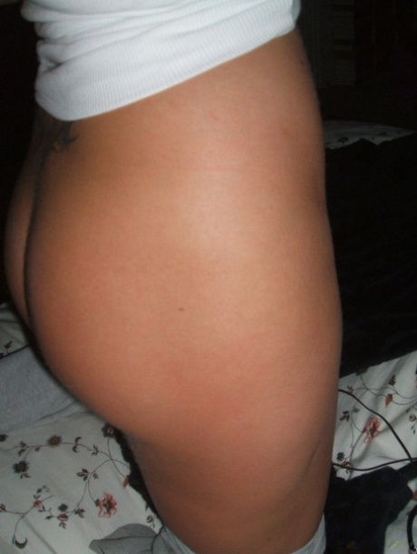 Blonde amateur removes her pants while taking self shots