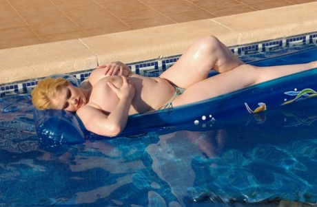 Fat first timer Ashley Sage Ellison goes topless on an air mattress