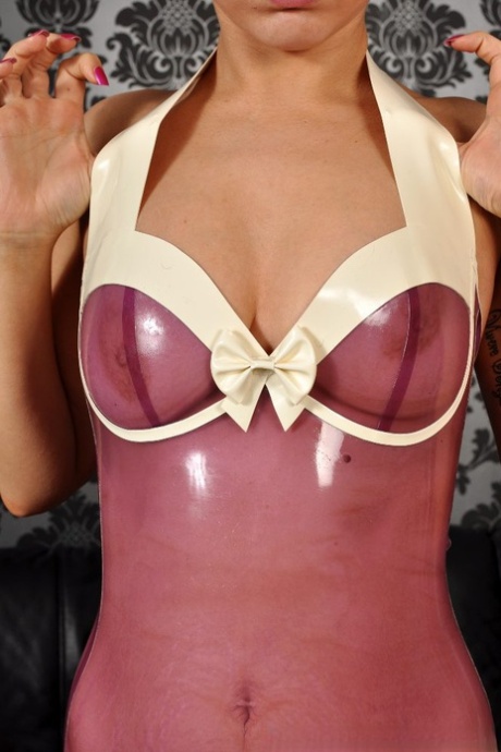 Solo girl with short red hair models sheer latex wear and latex stockings too