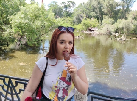 Redhead chubber Diana Rius eats a frozen treat outdoors before indoor POV sex