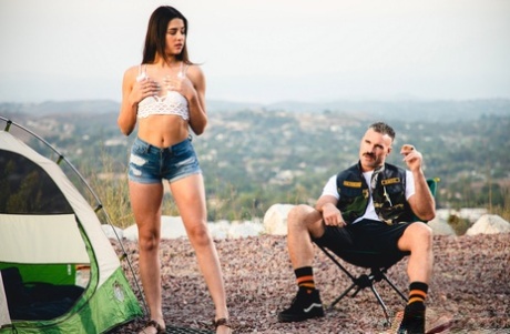 Kylie Rocket dons her man's colors after going nude while camping