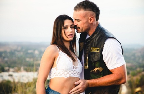 Kylie Rocket dons her man's colors after going nude while camping