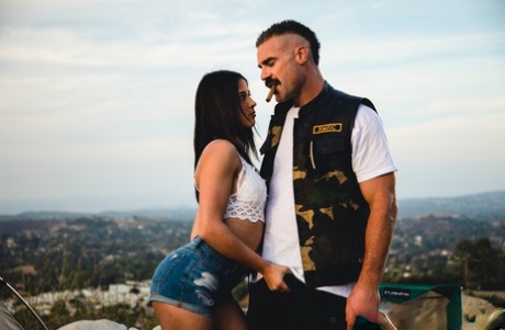 Kylie Rocket dons her man's colors after going nude while camping