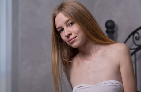 Skinny 18 Rina E gets completely naked while alone in her bedroom