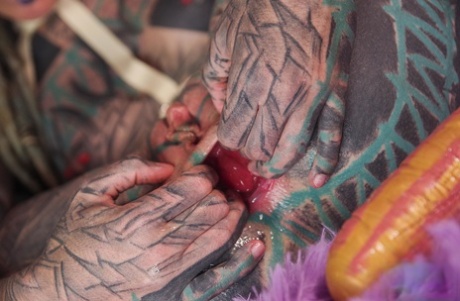 Heavily tattooed girl Anuskatzz fists her gaped asshole during solo action