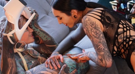 Heavily tattooed girls Nux Vomica & Anuskatzz partake in lesbian sex